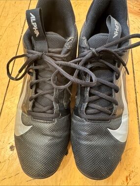 Nike Men's Black cleats with Silver Swoosh